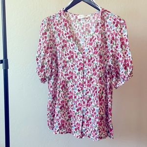 Solitaire pink and red flowered blouse.